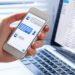 Smartphone user using chatbot feature on social media