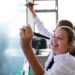 Private school students using chalkboard in classroom
